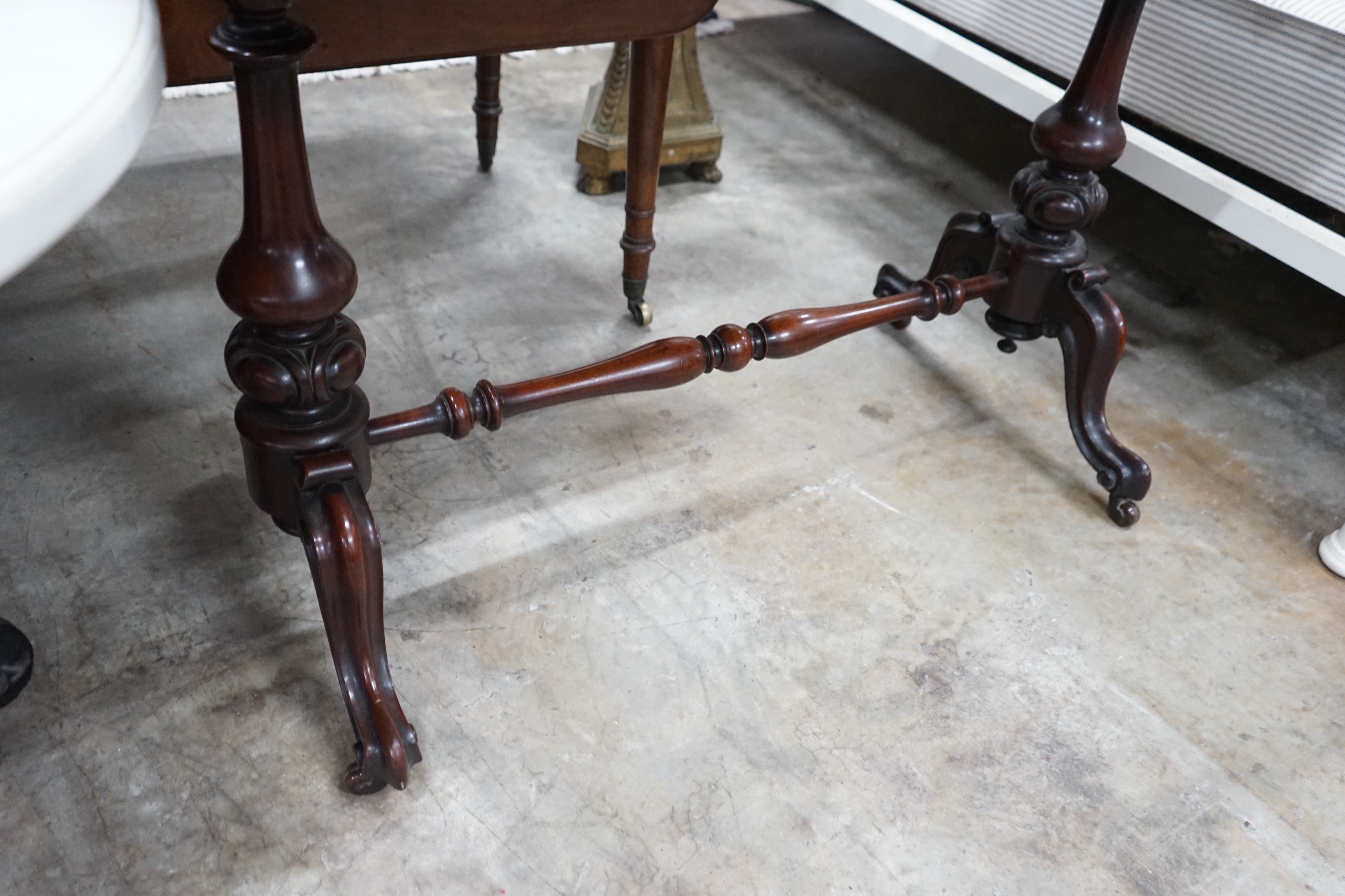 A Victorian mahogany stretcher table, length 106cm, depth 52cm, height 75cm